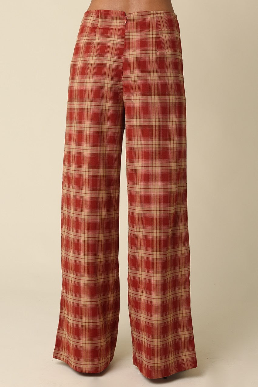 Red and beige plaid pants on a beige background