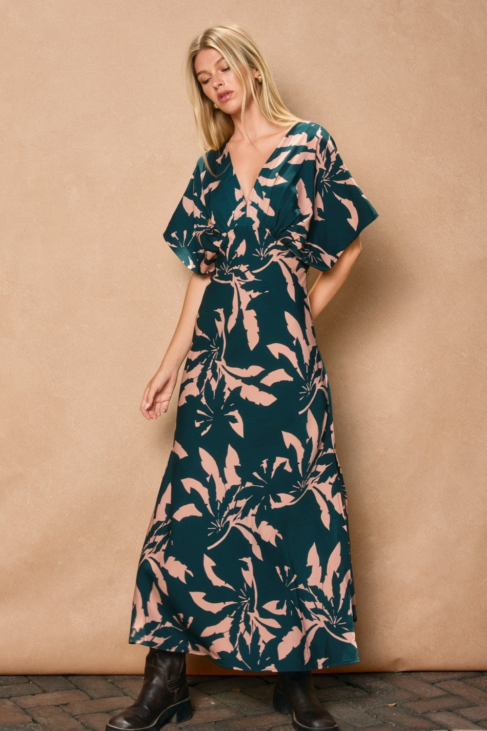 Woman wearing a floral dress against a beige wall

Floral satin maxi dress with a blouson top and slit detail.
- Blouson top
- Plunging neckline with hook and eye closures
- Dolman sleeves
- Left side slit 
- Hidden side zipper closure
- Unlined